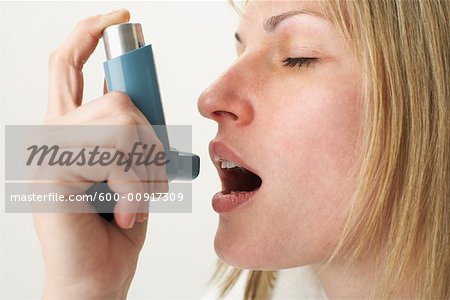 Woman Using Inhaler