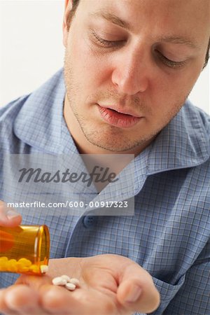 Man Taking Pills