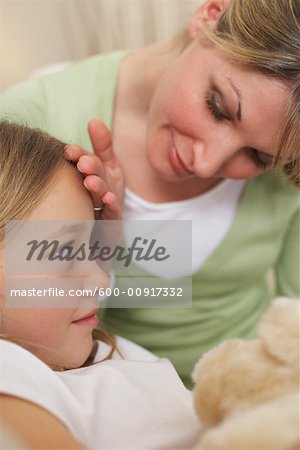 Mother Checking Daughter's Temperature