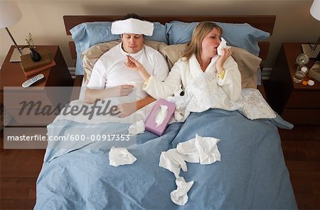 Sick Couple in Bed