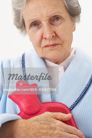 Portrait of Woman Holding Hot Water Bottle