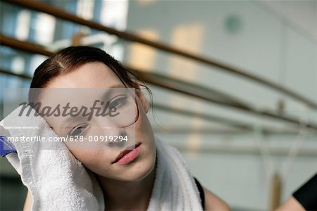 A female ballet dancer drying her face
