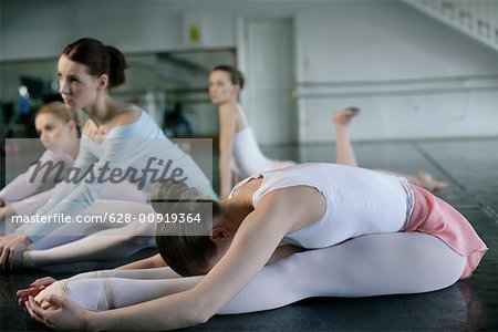 Female ballet dancers warming up