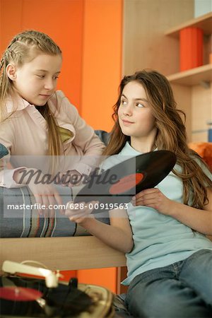 Two friends choosing records