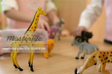 Children playing with toy-animals