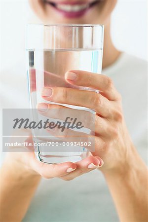 Woman Holding Glass of Water