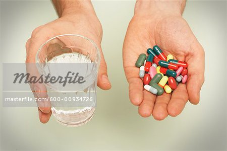 Hands Holding Pills