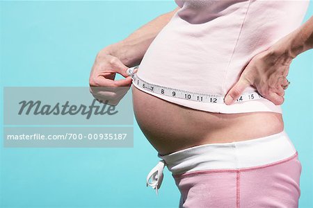 Pregnant Woman Measuring Stomach