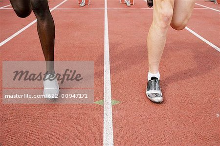 Legs of Male Runners Sprinting