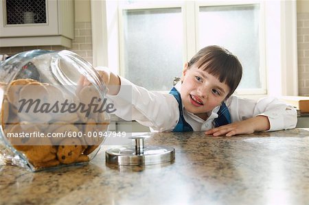 Girl Taking Cookie from Jar