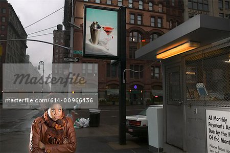 Woman on street with billboard