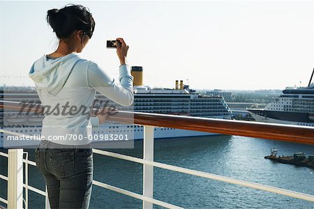 Woman Taking Photos from Cruise Ship