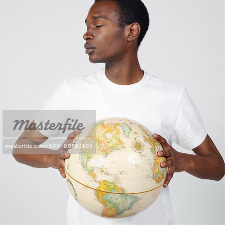 Portrait of Man Holding Globe