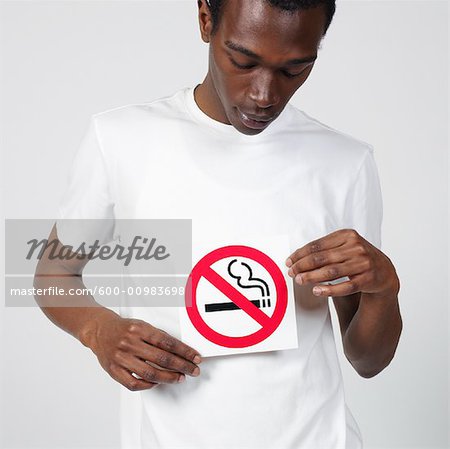 Man Holding No Smoking Sign