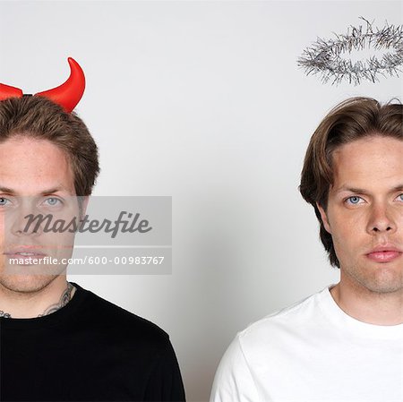 Portrait of Twin Brothers Dressed Like Devil and Angel