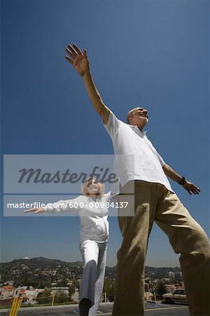 Mature Couple Pretending to Fly