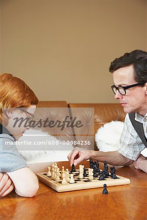 Father and Son Playing Chess