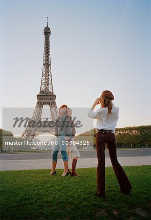 Woman Posing For Picture In Front Of Eiffel Tower, Paris, France