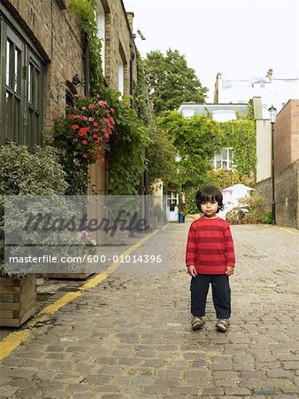 Portrait of Boy Standing In Street, Portobello, London, England