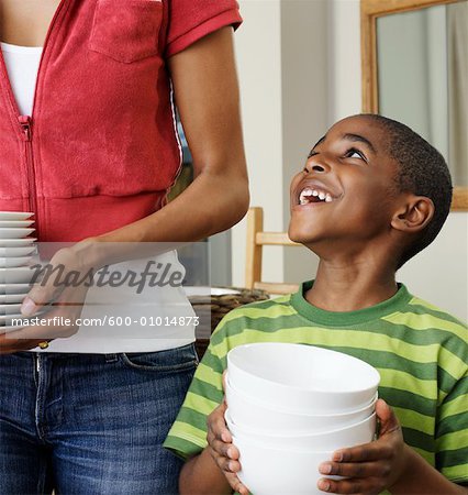 Mother and Son Holding Dishes