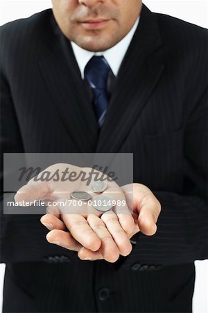 Businessman Holding Coins
