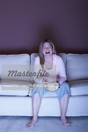 Woman with Popcorn Watching Television