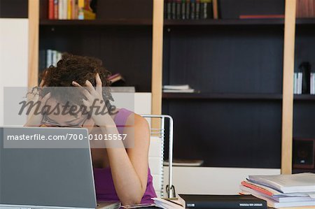 Frustrated Woman Using Laptop Computer in Home Office