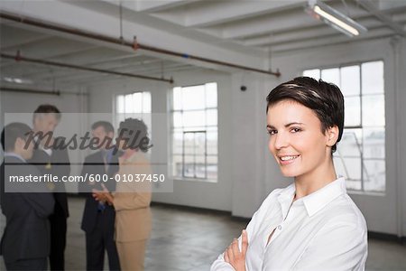 Portrait of Businesswoman with other Business People in Background