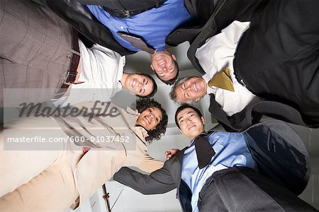 Group Portrait of Business People in Huddle