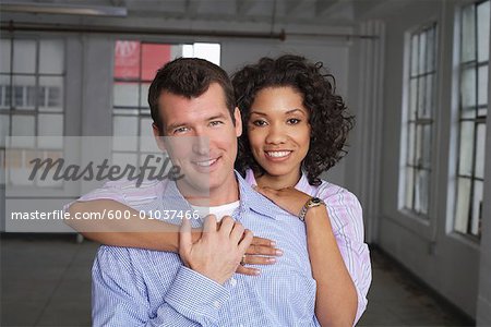 Portrait of Couple in Empty Loft Apartment