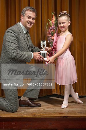 Ballerina Accepting Trophy