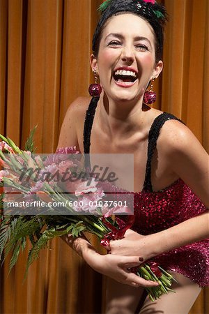 Woman on Stage Holding Flowers