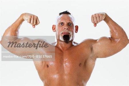 Portrait of Man Flexing Muscles