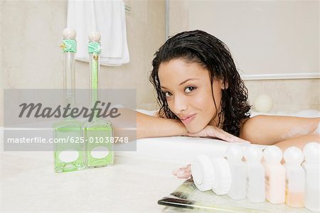 Portrait of a teenage girl having a bath
