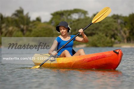 Teenage girl kayaking