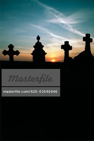 Silhouette of gravestones at sunset, Burgundy, France