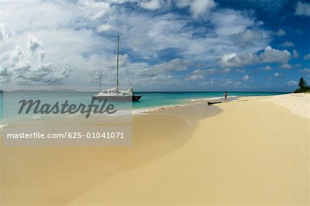 Side view of a boat along a beach Buck Island, St. Croix, Virgin Islands