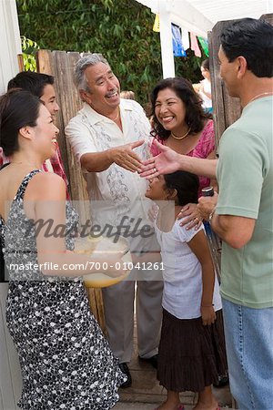 Family being Greeted at Family Gathering