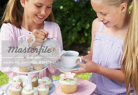 Girl Pouring Tea at Tea Party