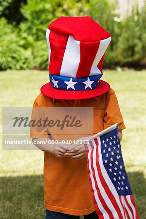 Portrait of Boy with Stars and Stripes Hat Covering Head