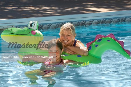 Grandmother and Granddaughter in Swimming Pool