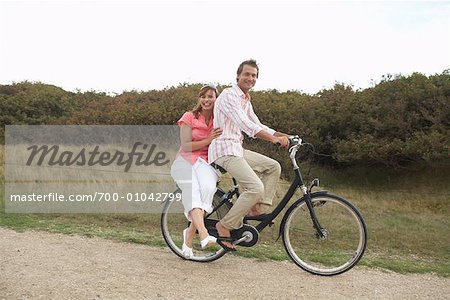 Couple Riding Bicycle Together