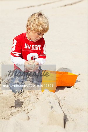 Boy Playing in Sand