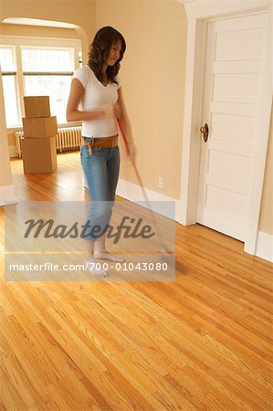 Woman Sweeping Floor