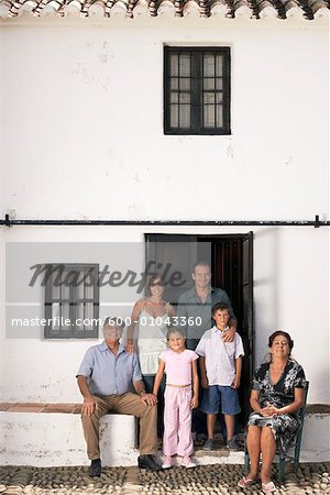 Portrait of Family in Front of Home