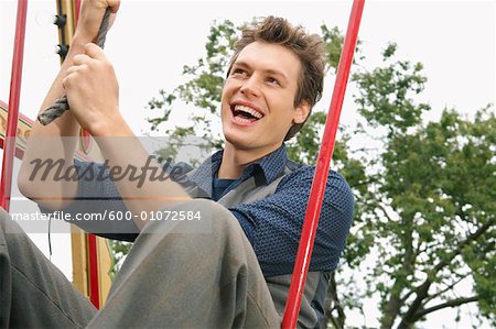 Man Riding Swingboats, Carters Steam Fair, England