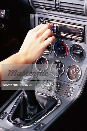 Woman Adjusting Car Radio