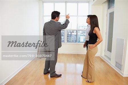 Couple in Condo with Real Estate Agent