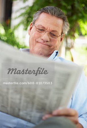 Portrait of Man Reading Newspaper