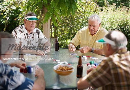 Men Playing Cards Outdoors